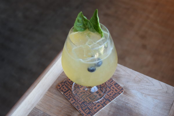 "Summer Sixteen." Inspired by the popular Drake song, which mentions Four Seasons, this summer sangria is served in a French Press. Rujero, basil, green tea, honeydew, yellow Chartreuse, lemon and berries are a perfect blend to sip this summer. 