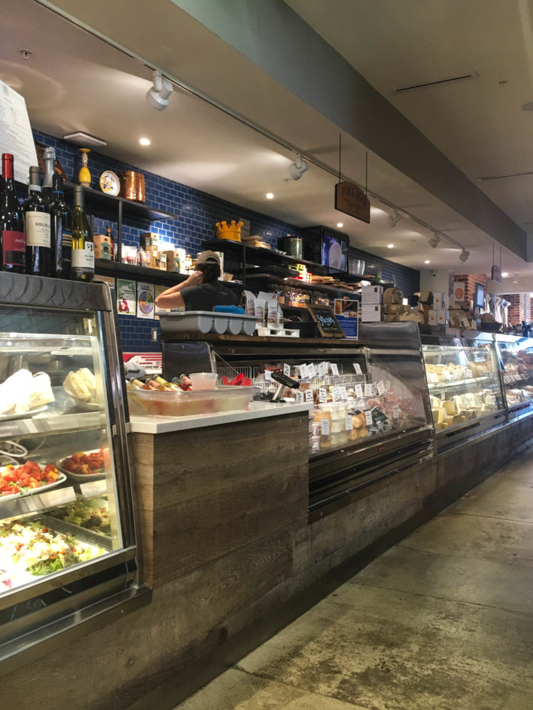 The cheese and butcher counter at Via Umbria. 